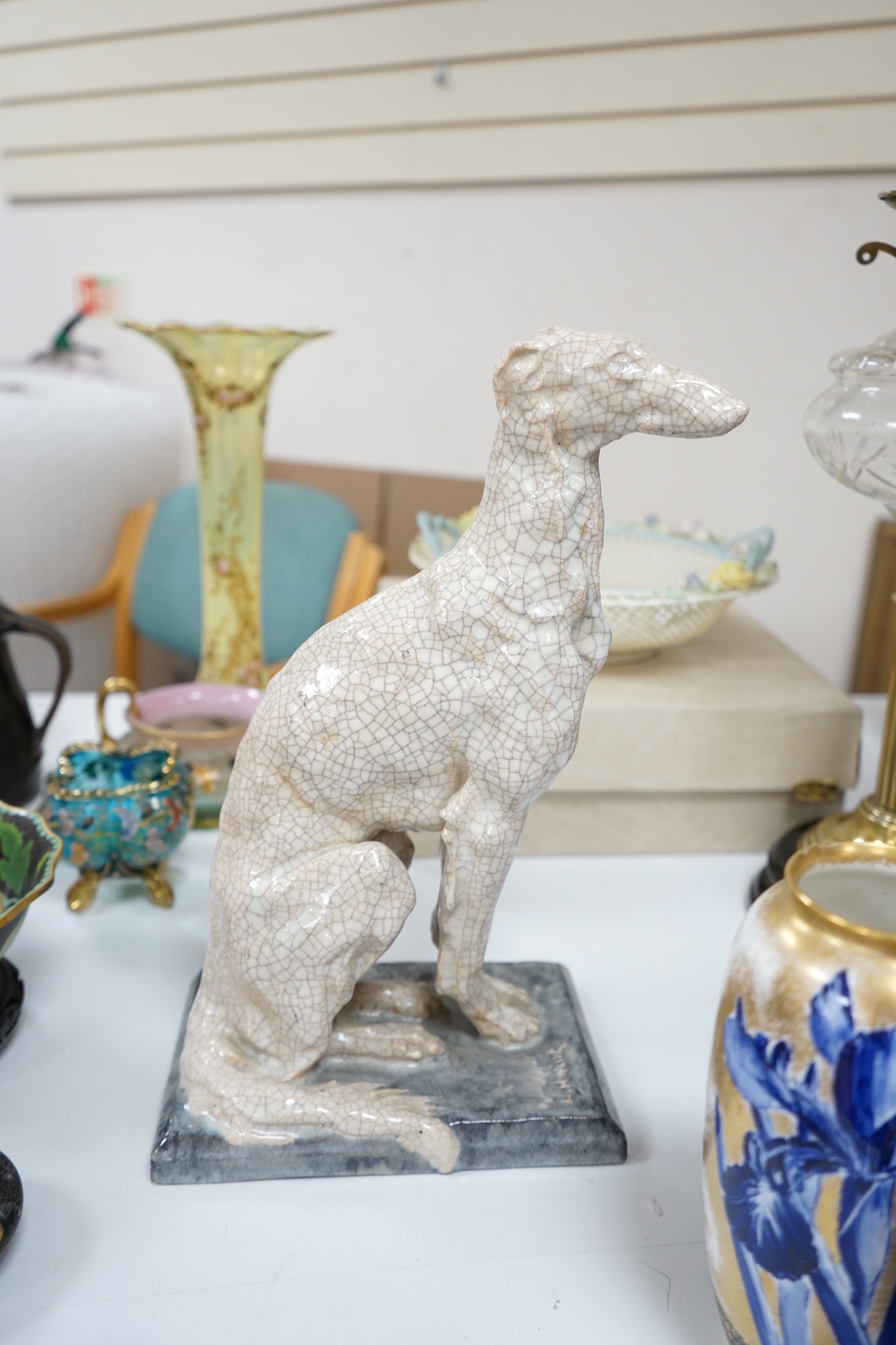 Louis Henri Nicot, Paris, a porcelain crackleglaze greyhound, signed to the base and with ‘Editions Erune Paris’ triangular stamp to the base along with a second incised signature, 35cm high. Condition - good.